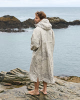 Lead_men - Man wearing a Vivida sherpa weatherproof changing robe desert sand by the sea