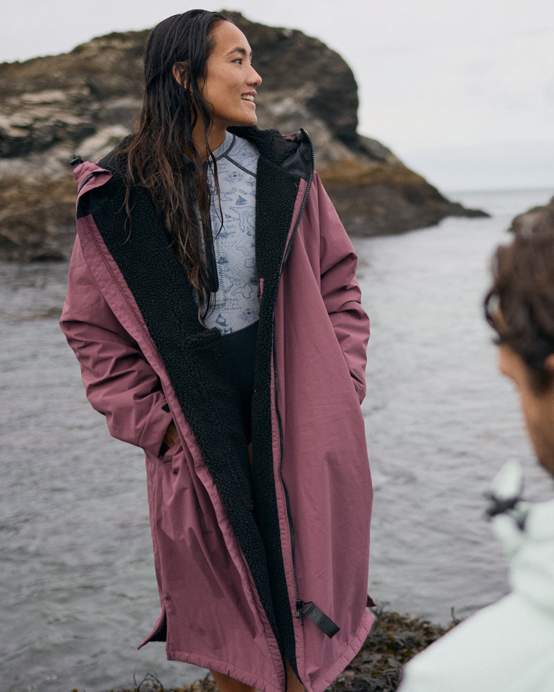 Lead_women2 - Woman wearing a Vivida sherpa weatherproof changing robe Purple Dusky Damson